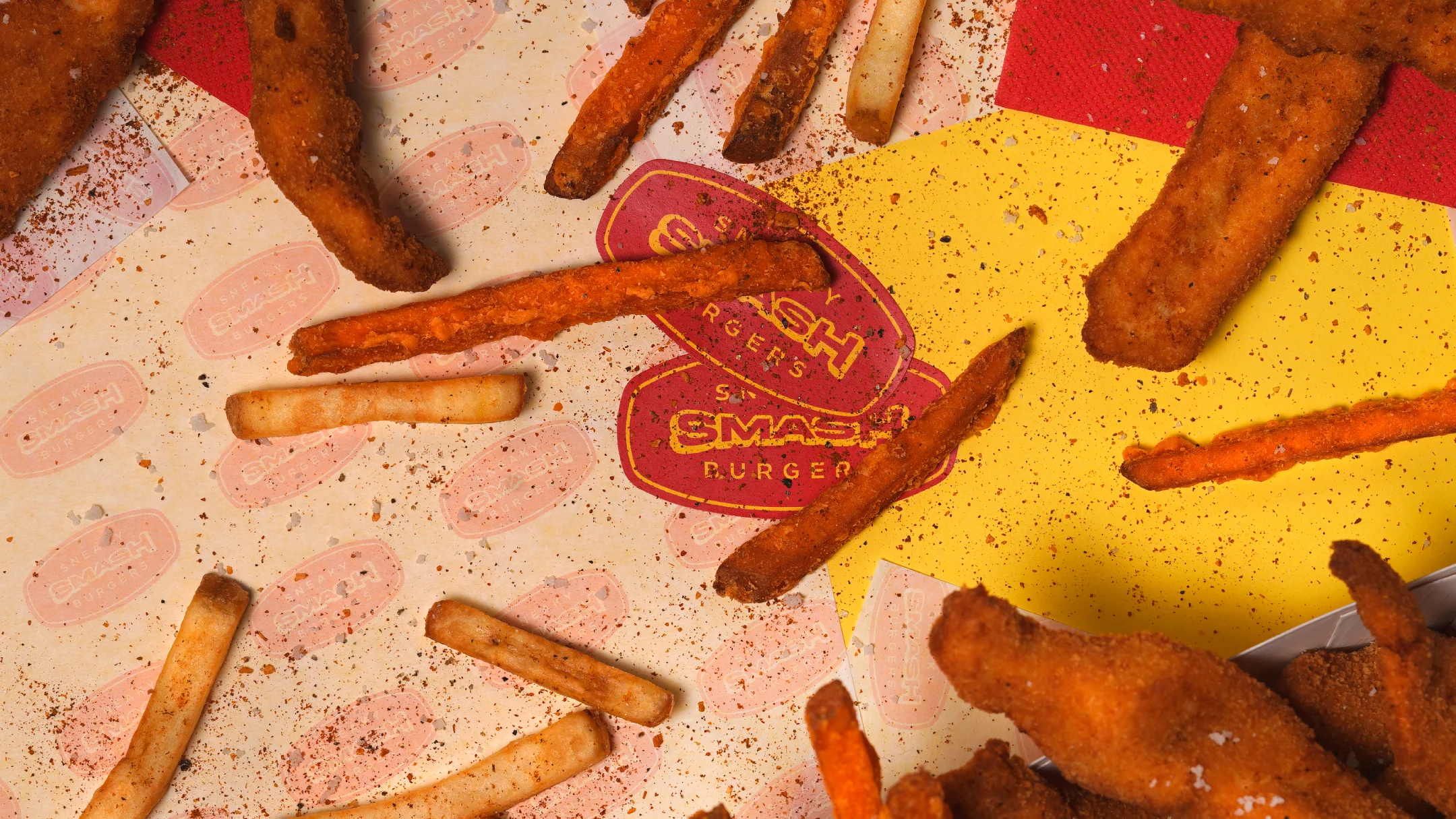 Nhdesign project SMASH VS THREAT: Open Sneaky Smash burgers with meat and toppings on yellow background