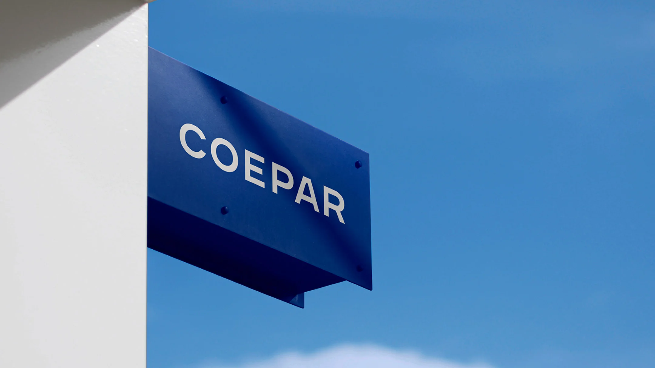 Nhdesign project Coepar: Coepar signage installed on a modern building facade