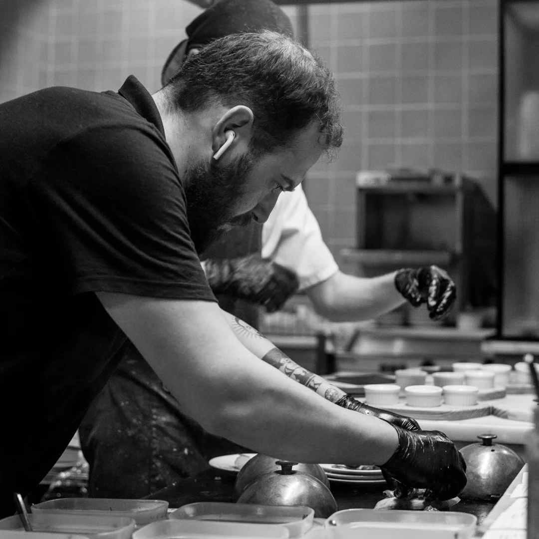 Nhdesign project DANS: Owner of DANS restaurant preparing food in the kitchen
