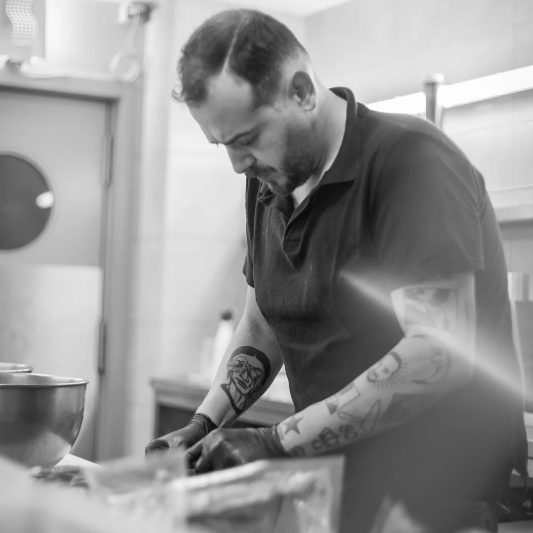 Nhdesign project DANS: Owner of DANS restaurant cooking in professional kitchen