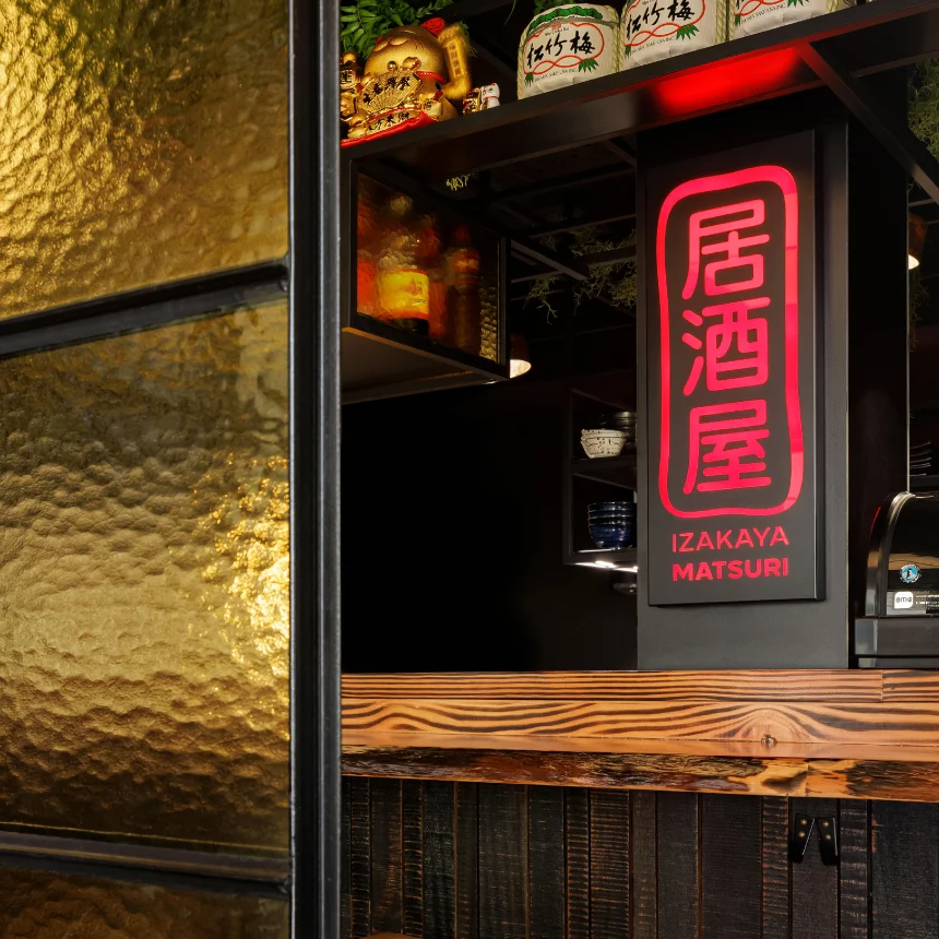 Nhdesign project Izakaya Matsuri: A glowing logo sign on a bar counter