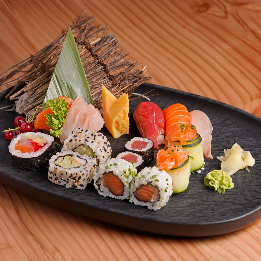 Nhdesign project Izakaya Matsuri: Photograph of an elegant black plate filled with a variety of sushi and other Asian dishes.