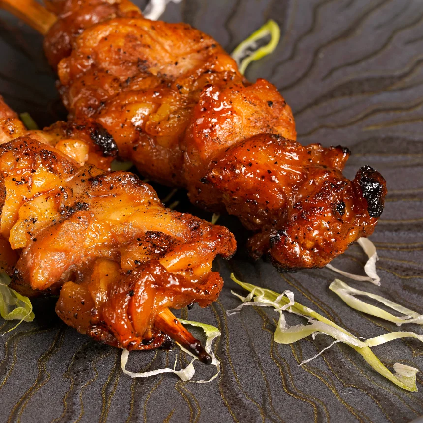 Nhdesign project Izakaya Matsuri: Close-up Photograph of two skewers on black plate