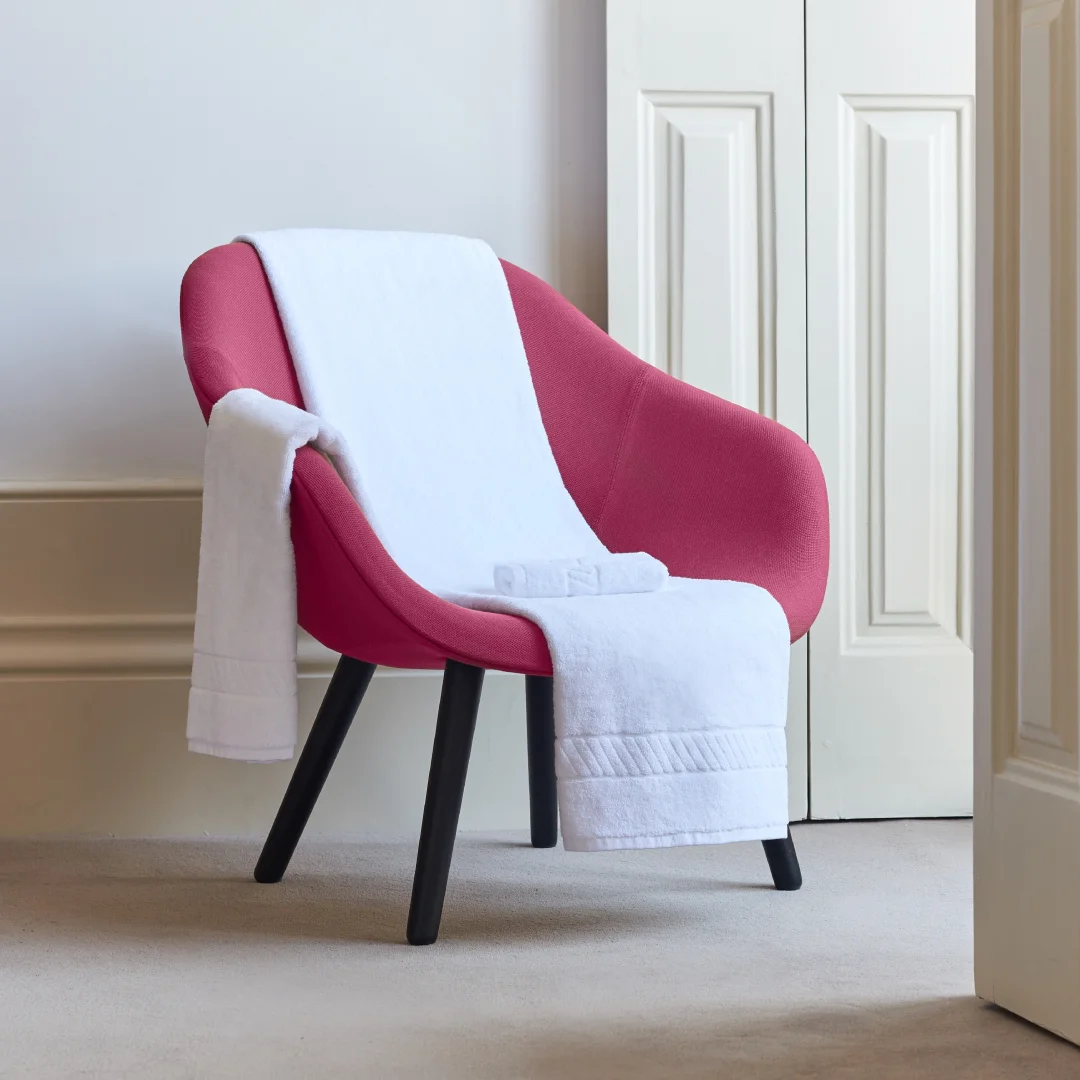 Nhdesign project Kazley: White armchair with red Kazley throw in a classic interior