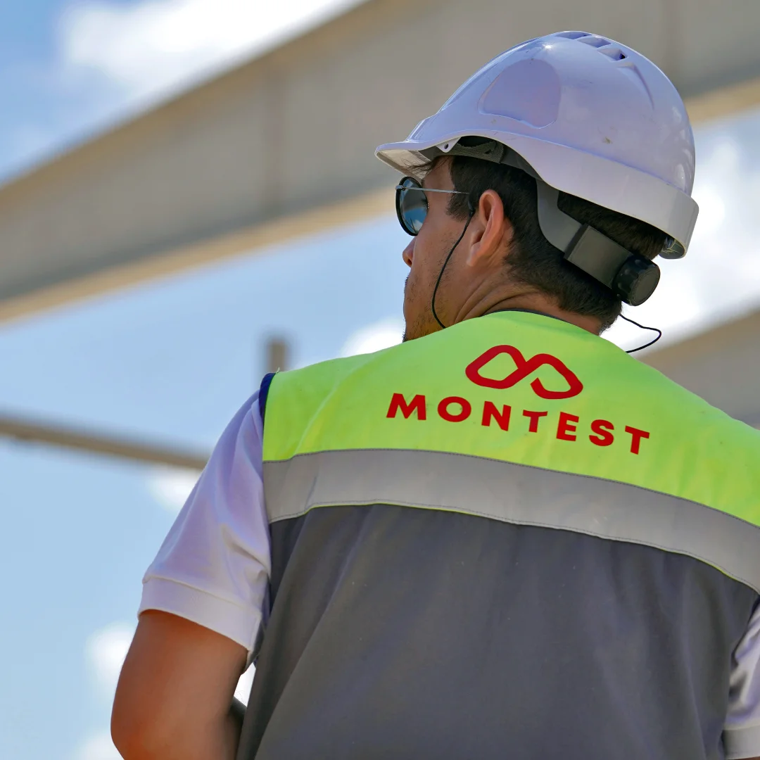 Nhdesign project Montest: Montest staff in reflective vest supervising construction.