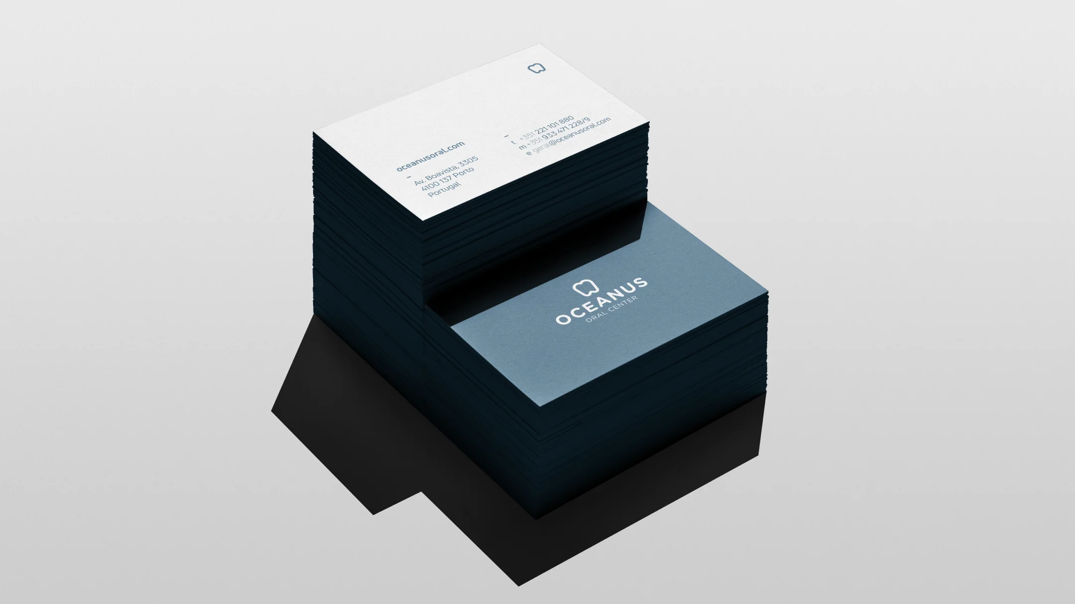 Nhdesign project OCEANUS: Oceanus Oral Center business cards in white and blue stacked