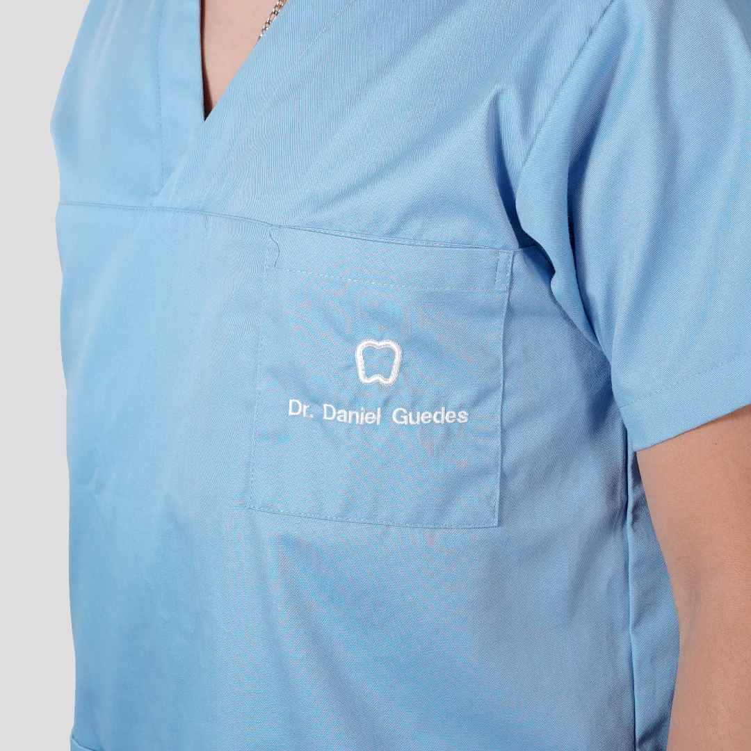 Nhdesign project OCEANUS: Detail of Oceanus Oral Center blue uniform with embroidered logo